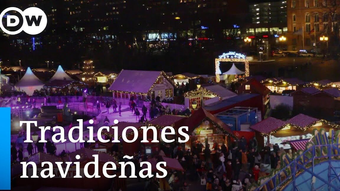 Mercado de Navidad de Sagunto con casetas iluminadas, luces festivas, multitud y pista de patinaje